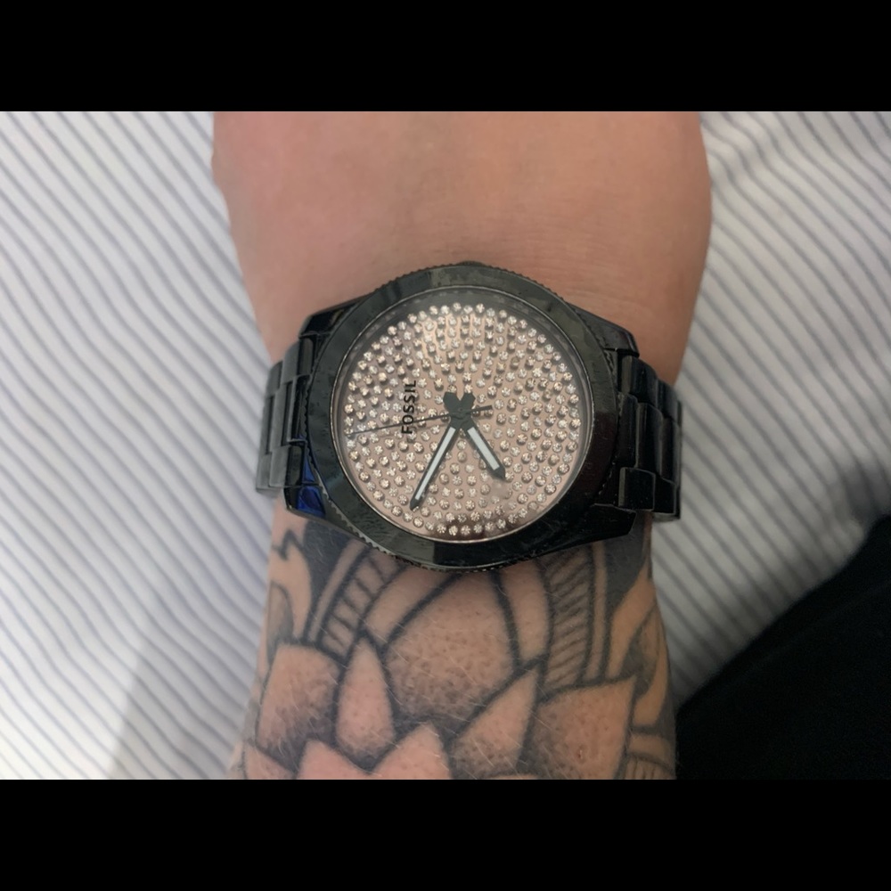 Black and gold Fossil watch